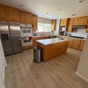 Photo 7: Kitchen where washer / dryer also are