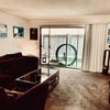 Photo 4: Lounge with private patio (for our unit only)