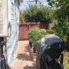 Photo 9: Side of house w/ additional gardening space