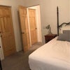 Photo 2: next to head board is the door to the room, the other door is access to the bathroom