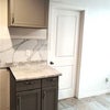Photo 3: Part of kitchen and bedroom door.