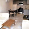 Photo 5: Front door entrance view- living room and kitchen. TV included!