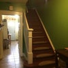 Photo 5: Stairs to 2nd FL, hallway leading to kitchen and back deck