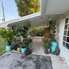 Photo 2: Front porch lounging area 