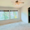 Photo 4: the room has a huge walk in closet, vaulted ceilings and windows
