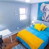 Photo 3: Bedroom with full bed and working desk