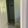 Photo 8: Bathroom. Sink and toilet on right with a window.