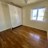 Photo 7: Mid-size bedroom with queen Murphy bed