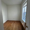 Photo 2: This bedroom can fit either a twin size plus a desk/drawer, or a queen size alone, there’s a share