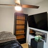 Photo 7: Smaller bedroom - tv, desk, fridge closet, bookcase