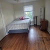 Photo 2: Full sized bed, shelves, tables - Flexible layout of room.