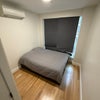 Photo 1: Your private bedroom with hardwood floors, in-unit climate control, and large window with blackout s