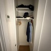 Photo 5: Well-organized closet with shelving, hanging rod, and individual climate control