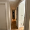 Photo 7: Clean hallway with beautiful hardwood floors connecting private bedroom to common areas