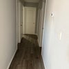 Photo 6: Hallway - room for rent is the door on the far left and shared bathroom on the right.
