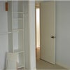 Photo 3: Closet w/varied wooden shelves