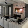 Photo 2: You will enjoy a soft and comfortable sofa in the living room, a tv with power speakers and a table 