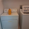 Photo 2: Laundry room down the hall. 