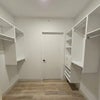 Photo 3: Walk-Through Closet (Primary Bedroom)