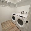 Photo 9: In-unit Laundry Room with washer and dryer