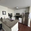 Photo 4: Kitchen, electric stove, refrigerator, microwave