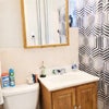 Photo 4: Bathroom with shower curtain, toilet andm, sink