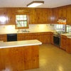Photo 9:  kitchen with pantry and laundry room on left