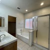 Photo 4: Private bathroo with tub, toilet, & shower