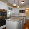 Photo 7: Full kitch, double stove, subway tiles backing