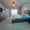 Photo 5: Master Bedroom 1 large spacious with private bath, shower, sliders to lanai, pool, lake