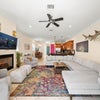 Photo 1: Comfy living room opens to porch