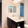 Photo 6: double-sink vanity where you have your own private sink and storage.