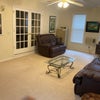 Photo 7: This is a relaxation room with recliner, sofa bed, and desks with chairs