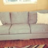 Photo 8: One of two sofas in the shared Living room