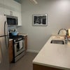 Photo 5: Kitchen w/gas range, microwave, DW