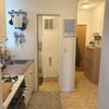 Photo 4: Kitchen, bathroom, and hallway leading to bedroom for rent