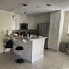 Photo 3: kitchen and living area