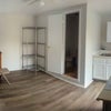 Photo 8: House Two: Shared living + Kitchen into Bathroom