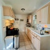 Photo 5: Kitchen with dishwasher, stove, fridge, slow cooker, air fryer
