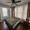 Photo 6: Spacious bedroom with hardwood floors and plenty of natural light.