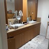 Photo 5: Sinks with large dressers across from sinks