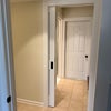 Photo 5: Bathroom is to the left, laundry room is just past the doorway and to the left.