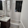 Photo 3: Clean and bright shared bathroom. Features a full tub and classic Brooklyn tiling. We’ll share