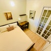 Photo 4: Room 2 – furnished with bed, desk, and closet