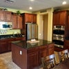 Photo 7: Chef’s kitchen — granite counters, gas range, double oven