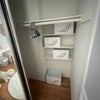 Photo 4: Sliding double door mirrored closet with shelving and storage boxes. 