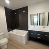 Photo 3: Private Bathroom for the master suite with bathtub and 2 sinks vanity.
