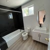Photo 6: Shared Bathroom with bathtub and modern vanity