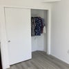 Photo 6: Room's closet with double clothes bar