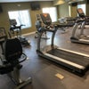 Photo 9: Gym with 2 42" TVs